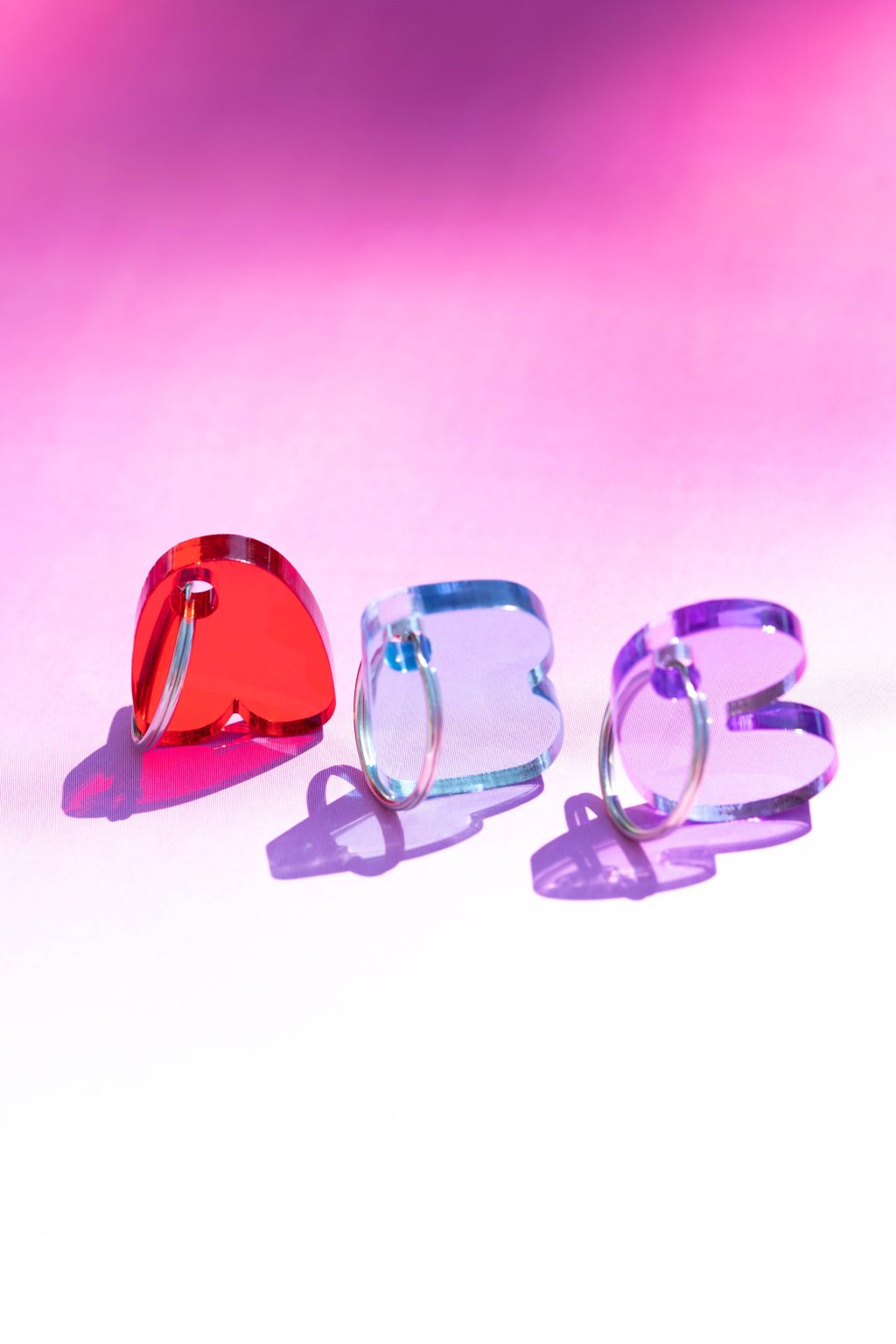 Momantai Chubby Keychain, A, B and C, with a gradient background from pink to white.